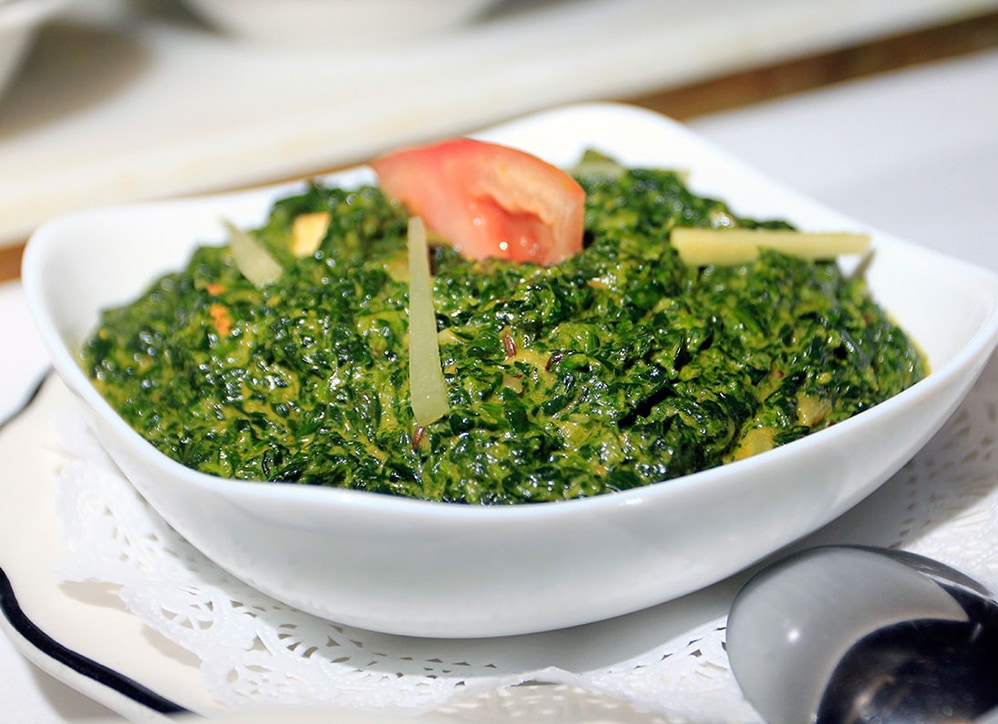 Saag — slow-cooked spinach with fresh tomato